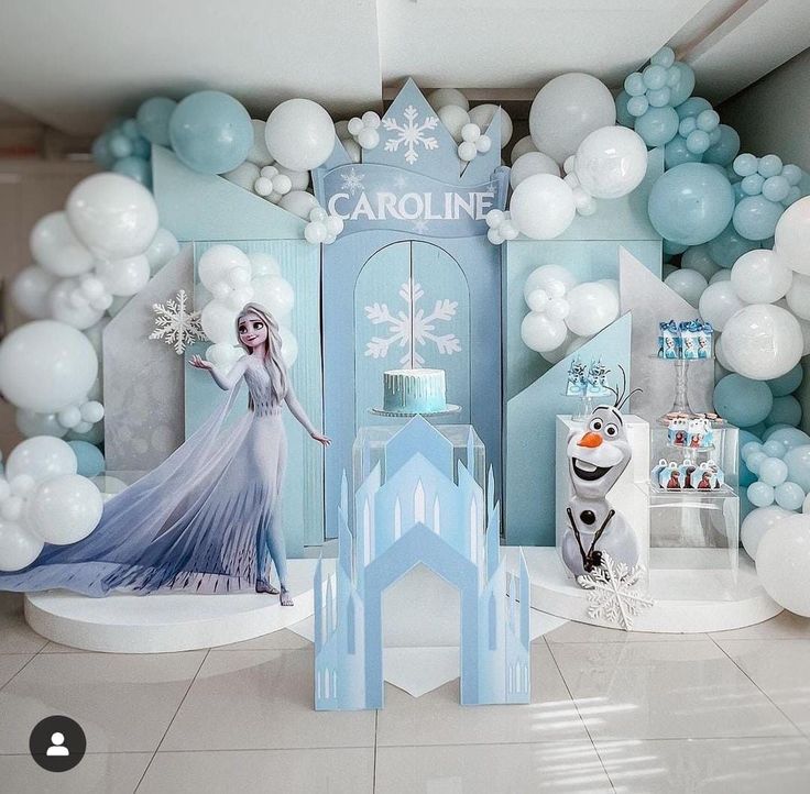 a frozen princess birthday party with balloons and decorations