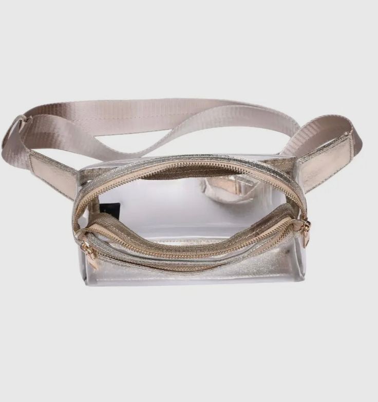 Ideal for concerts or game day, Christy's Clear Belt Bag offers the convenience of hands-free carrying. With its transparent design, this bag also meets security guidelines for quick and easy entry to events. Enjoy the freedom to move without sacrificing style or safety. Metallic Gold Color, Boutique Stores, Summer Concert, Denim Shoes, Transparent Design, Instagram And Snapchat, Dress Jewelry, Workwear Dress, Belt Bag