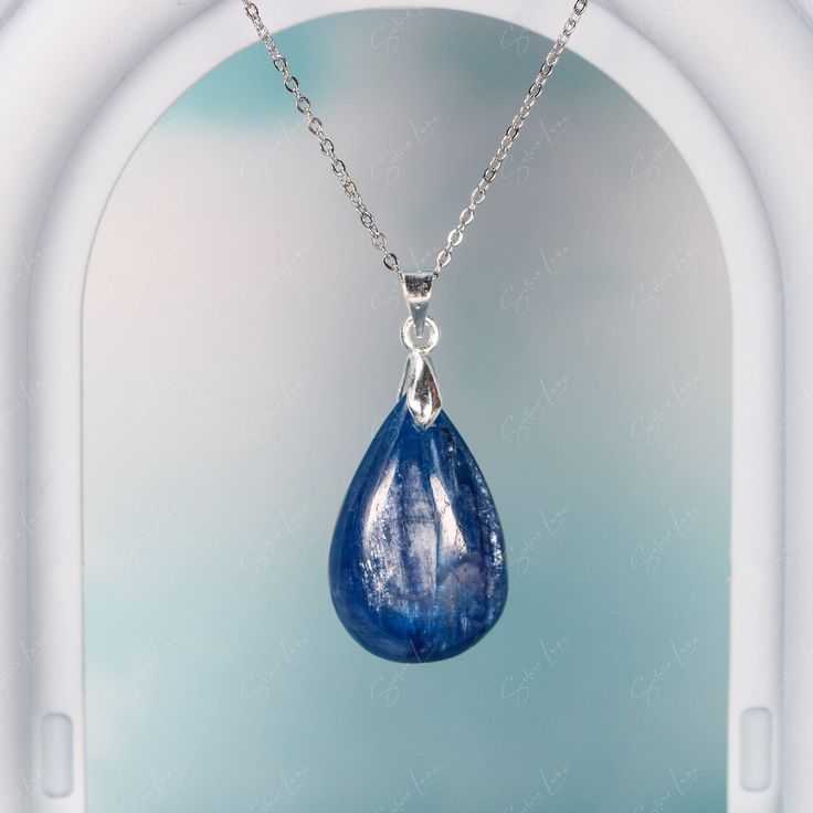 This elegant blue Kyanite teardrop pendant necklace is like a raindrop from heaven, the stone has a beautiful texture in blue green color. It's simple, yet elegant, and will be a great accent on your everyday outfit. Experience the beauty of nature with this stunning blue Kyanite pendant necklace! The unique teardrop design and vibrant blue-green color make it a truly eye-catching piece. Elevate any outfit with the simple yet elegant touch of this luxurious necklace. Each time you wear it, you'l Sapphire Drop Necklace For Gift, Sapphire Drop Necklaces For Gifts, Sapphire Teardrop Pendant Jewelry, Elegant Blue Teardrop Drop Necklace, Blue Drop Necklace For Gift, Blue Drop Necklaces For Gifts, Elegant Blue Teardrop Crystal Necklace, Gift Blue Drop Necklace With Natural Stones, Blue Gemstone Teardrop Pendant Necklace