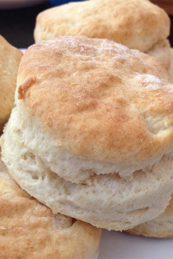 several biscuits are stacked on top of each other in a white plate and ready to be eaten