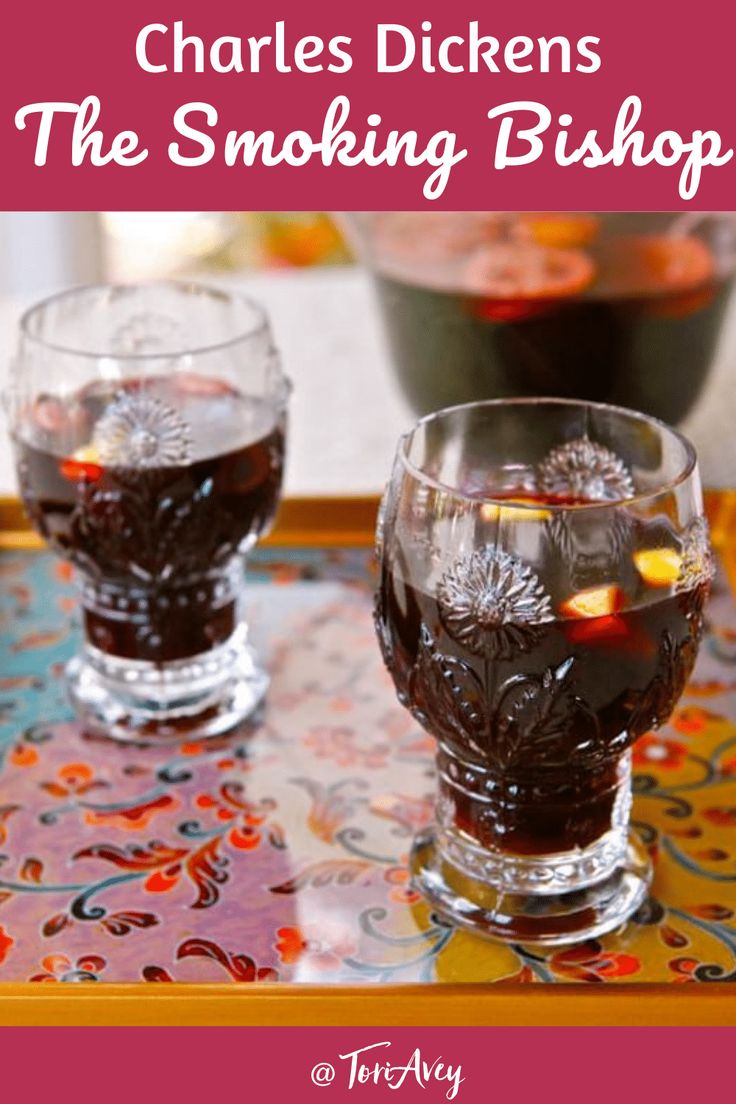 two glasses filled with liquid sitting on top of a table