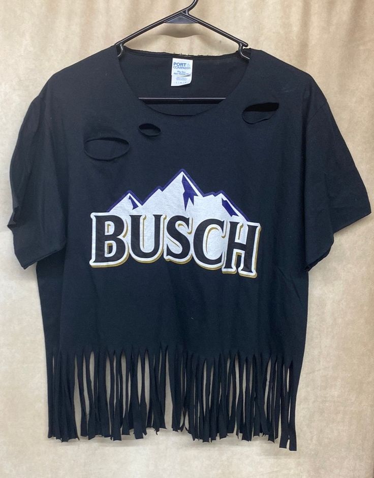 One of a kind upcycled by jordigans, busch graphic t with fringe and distressed. Retro Pre-shrunk Shirt For Concert, Budweiser Fringe Shirt, Retro Distressed T-shirt For Spring, Trendy Short Sleeve T-shirt With Fringe, Pre-shrunk Graphic Tee For Country Concerts, Graphic Tees, Gender Neutral, Bathing Beauties, Tops & Tees