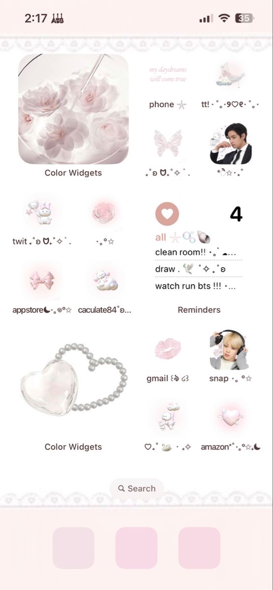 an iphone screen with pink and white items on it, including a heart - shaped object