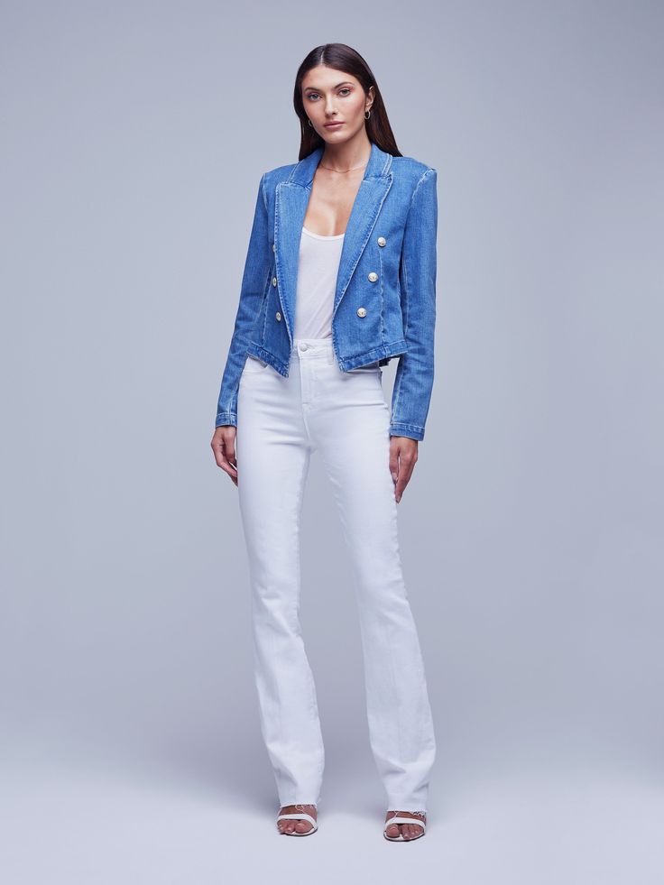 A sleekly designed cropped blazer in a faded bule stretch twill. Military-inspired details include strong shoulders, peaked lapels and tonal anchor buttons trimming the front. Includes a tapered silhouette that highlights the waist. Finished with long sleeves. Fitted Cropped Jacket With Double-breasted Button, Fitted Denim Cropped Jacket For Work, Fitted Denim Cropped Jacket With Buttons, Spring Fitted Denim Jacket With Notch Lapel, Fitted Notch Lapel Denim Jacket For Spring, Fitted Denim Jacket With Notch Lapel For Spring, Fitted Double-breasted Cropped Jacket For Spring, Chic Fitted Denim Jacket With Snap Buttons, Chic Fitted Single-breasted Denim Jacket