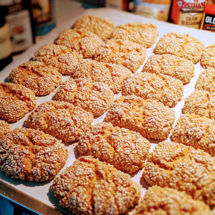 some powdered sugar cookies are on a baking sheet