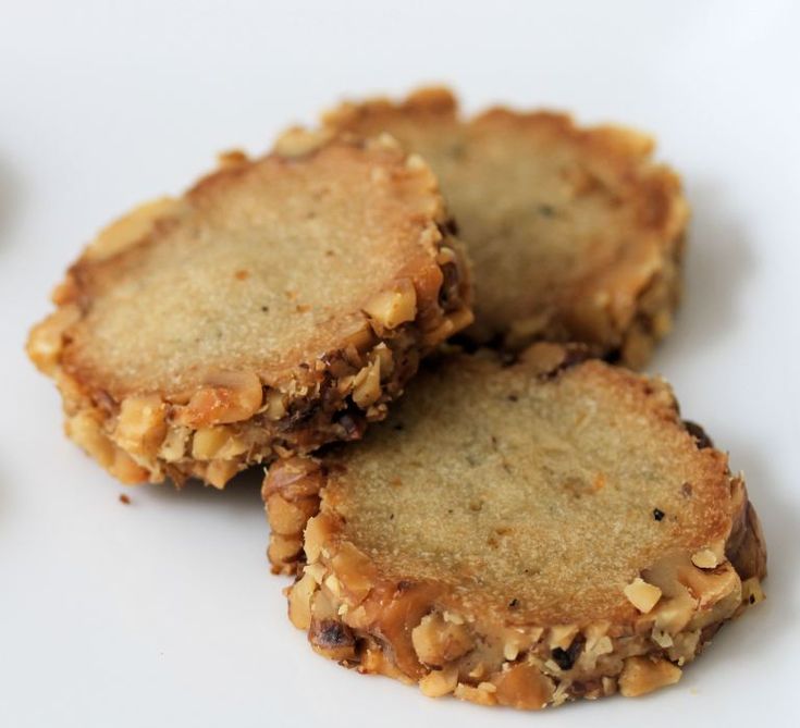 three pieces of cookies on a white plate