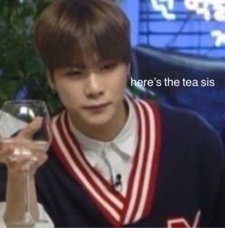 a young man holding a wine glass in front of him with the caption here's the tea sis