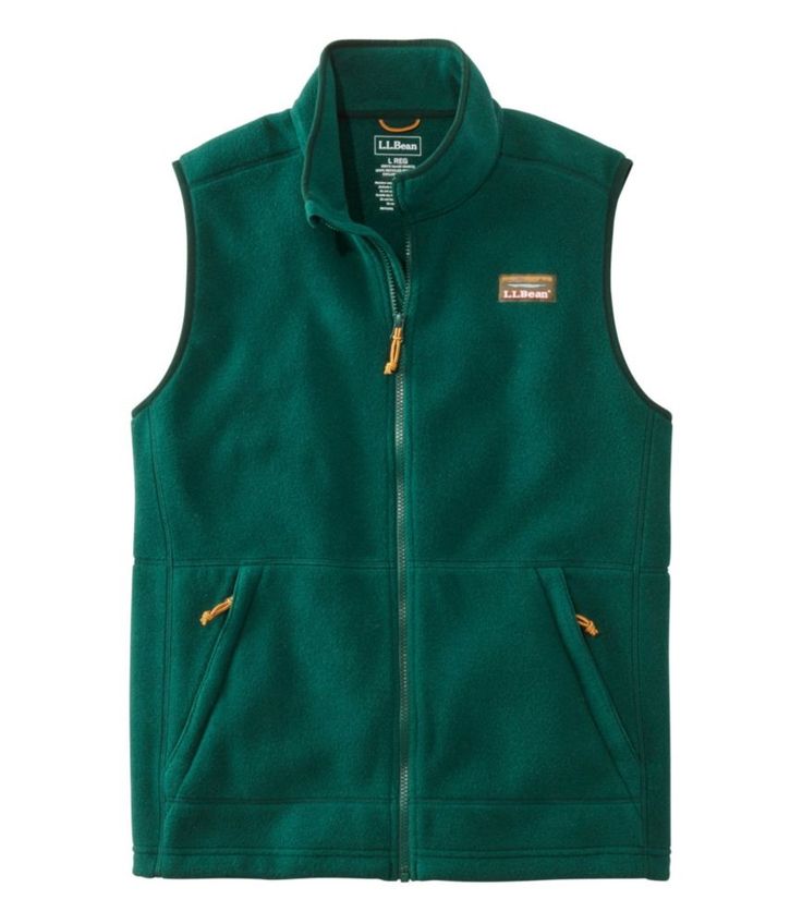 Our best-value fleece vest is designed with inspiration from our archives and made from 100% recycled polyester for unbeatable comfort and wear-anywhere style. Slightly Fitted. Best with lightweight layer. Falls at hip. 100% recycled polyester fleece. Machine wash and dry. Features our classic Mount Katahdin logo. Bean Boot lace-inspired zippers and drawcord. Two lower zippered hand pockets. Elastic arm holes and drawcord hem seal out cold air. Imported. Mount Katahdin, Men's Vests, Mens Vests, Bean Boots, Fleece Vest, Cold Air, Mens Outerwear, L L Bean, Shopping Trip