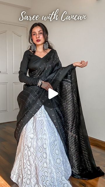 𝐀𝐫𝐜𝐡𝐞𝐞 | Saree Drapes on Instagram: "Save and send this Saree on Lehenga tutorial to a saree lover 🖤

Draped a pure silk saree in mulberry with tanchoi weave on deep black body topped with sterling silver zari woven 1000 butas and a classy double border.

Created a unique saree draped or unique saree styling tutorial for saree beginners. Paired it with a cancan and a long flared skirt. Added oxidised jewellery to complete the look.

How to wear a saree on cancan-
🖤 Pick lightweight pure silk sarees fabric like Katan silk, mulberry silk, tussar silk, khaddi chiffon, khaddi georgette, gajji silk and assam silk.
🖤 Layer up your cancan as much as you want but make sure it’s easy to walk in.
🖤 You can drape the saree in half saree pattern or as a regular saree depending upon the fabri Styling Saree With Tops, Different Half Saree Draping Styles, Lehenga Drape Saree, Saree To Lehenga Draping, Black Saree Party Wear Fashion Styles, Saree Draping In Lehenga Style, Mix And Match Blouses For Sarees, How To Wear Half Saree, Half Saree With Saree