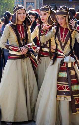 group of women in traditional dress performing folk dance