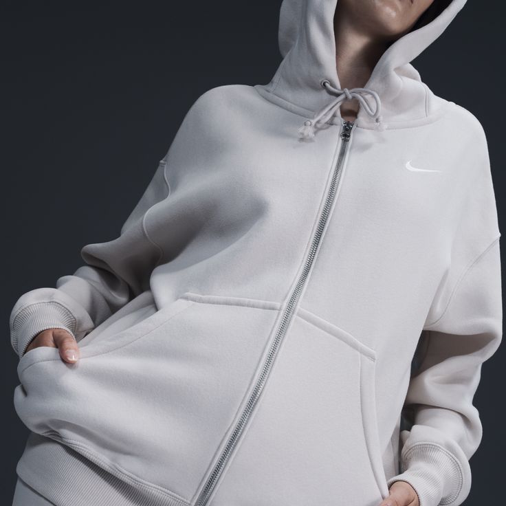 Find NIKE Sportswear Phoenix Fleece Oversized Full-zip Hoodie on Editorialist. Grounded in style, comfort and versatility, meet our take on luxury loungewear. This zip-up hoodie helps you stay cozy all day long, thanks to midweight fleece that feels soft yet structured. Plus, exaggerated details (like the oversized pocket and taller ribbing) give you a trend-right look. Benefits:Our midweight brushed fleece feels extra soft on the inside and smooth on the outside, helping you stay cozy while kee Nike Athleisure Track Jacket, Nike Athleisure Hoodie For Streetwear, Nike Activewear With Drawstring Hood For Gym, Nike Winter Leisure Sweats, Sporty Fleece Track Jacket With Relaxed Fit, Athleisure Track Jacket With Double-lined Hood, Athleisure Hooded Jacket With Ribbed Cuffs For Gym, Athleisure Fleece Hooded Jacket With Ribbed Cuffs, Athleisure Sweats With Double-lined Hood For Loungewear