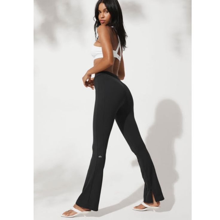 Brand New Versatile Alo Yoga Bottoms, Alo Yoga High Stretch Athleisure Bottoms, Chic Yoga Pants, High Stretch Sporty Pants By Alo Yoga, Sporty Stretch Bottoms For Night Out, High Stretch Alo Yoga Pants For Yoga, Alo Yoga High Stretch Workout Pants, High Stretch Alo Yoga Workout Pants, Black Stretch Alo Yoga Bottoms