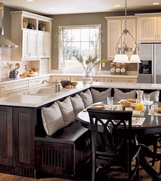 a kitchen filled with lots of counter space next to a dining room table and chairs