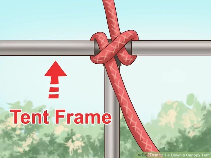 a close up of a metal pole with a knot on it's end and an arrow pointing to the right