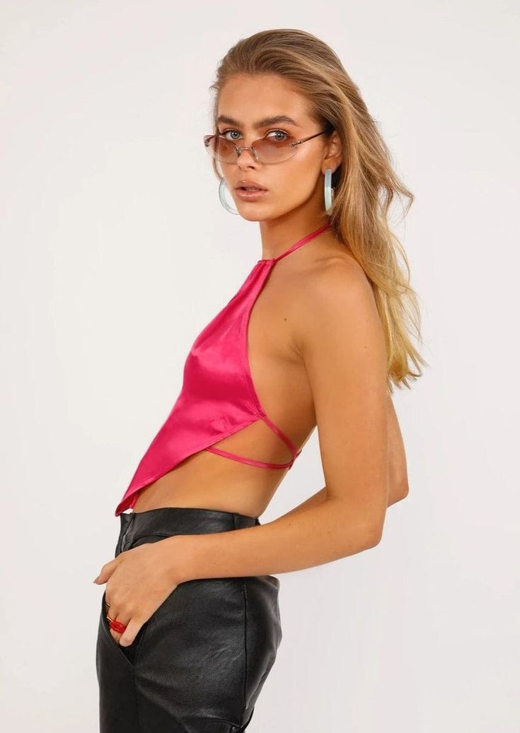 The EMES SHOP top is detailed with a halter neckline. completely open back. and string tie closure. Features a cropped v-hemline. Pair this sleek top with a pair of faux leather pants or a mini skirt for the perfect night out look.MATERIAL:80% Soft Poly. 20% CottonMEASUREMENTS:Small : 4-6 Waist: 25-26.5 in Chest: 33-34.5 in Length: 16.9" in Medium : 6-8 Waist: 26.5-28 in Chest: 34.5-36 in Length: 17.3" in Large : 8-10 Waist: 28-29.5 in Chest: 36-37.5 in Length: 17.7" in Chic Strappy Back Crop Top For Spring, Summer Crop Top For Going Out, Triangle Halter Top With Tie Back For Night Out, Trendy Strappy Halter Top For Night Out, Tie Back Triangle Halter Top For Night Out, Triangle Tie Back Halter Top For Night Out, Tie-back Triangle Halter Top For Night Out, Triangle Tie-back Halter Top For Night Out, Chic Cropped Halter Top For Party