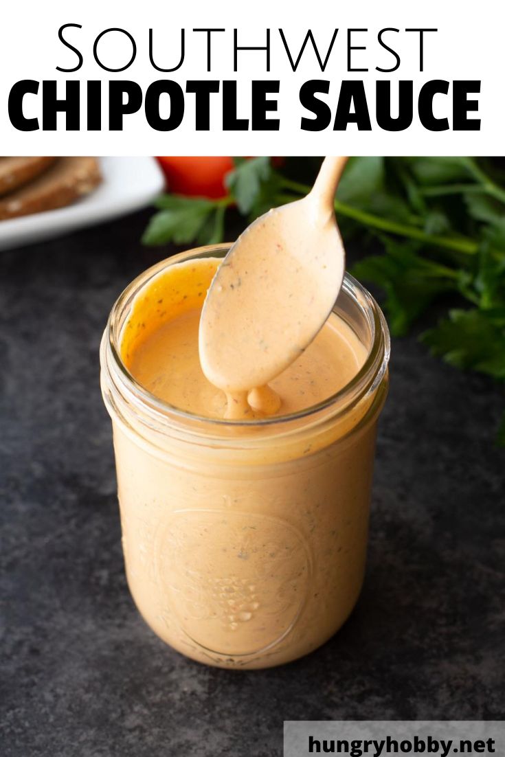 a spoon full of chipotle sauce in a jar