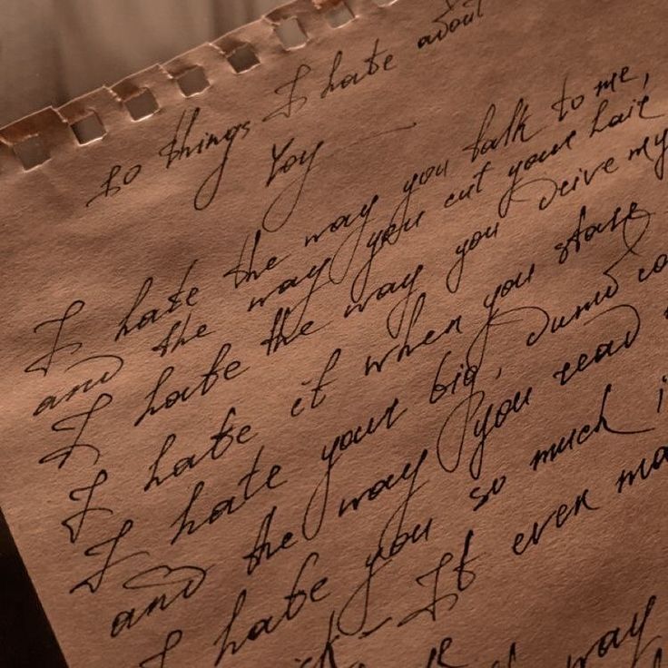 a piece of paper with writing on it that is written in cursive ink