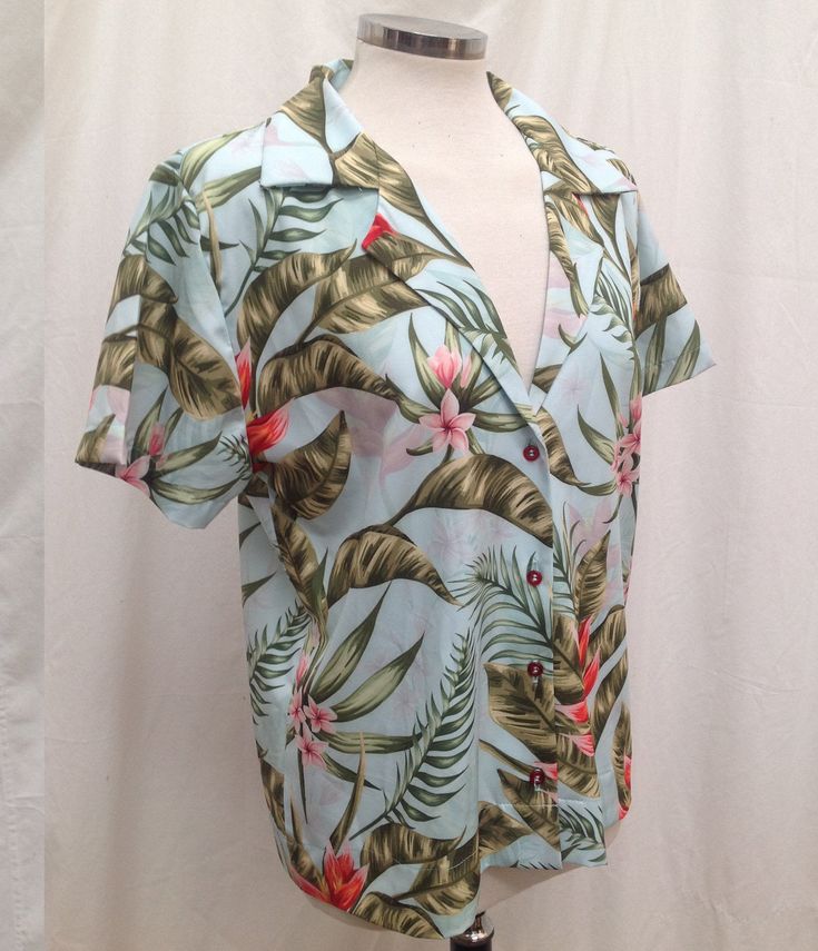 Womens Aqua & Coral Pink Aloha Shirt, Tropical Ginger Flowers on Hawaiian Blouse. Gorgeous Vibrant full-color images in just the right color combo to make you look your best. * Fitted short sleeve shirt with a notched lapel and button up front closure. * Made of high-quality 100% quick dry polyester poplin * Lightweight and breathable * Hand Wash with Delicate Soap and Hang Dry * Available in sizes from XS up to 3XL This fabric pattern is available by the yard at our custom fabric ETSY shop: Collared Tops With All Over Print For Vacation, Summer Short Sleeve Printed Tops, Multicolor Short Sleeve Hawaiian Shirt, Green Floral Print Short Sleeve Hawaiian Shirt, Summer Short Sleeve Graphic Print Blouse, Summer Short Sleeve Blouse With Graphic Print, Multicolor Floral Print Short Sleeve Camp Shirt, Vacation Short Sleeve Shirt With All Over Print, Multicolor Short Sleeve Tops With Hibiscus Print