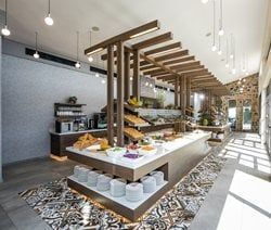 a restaurant with lots of counter space and food on the table in front of it