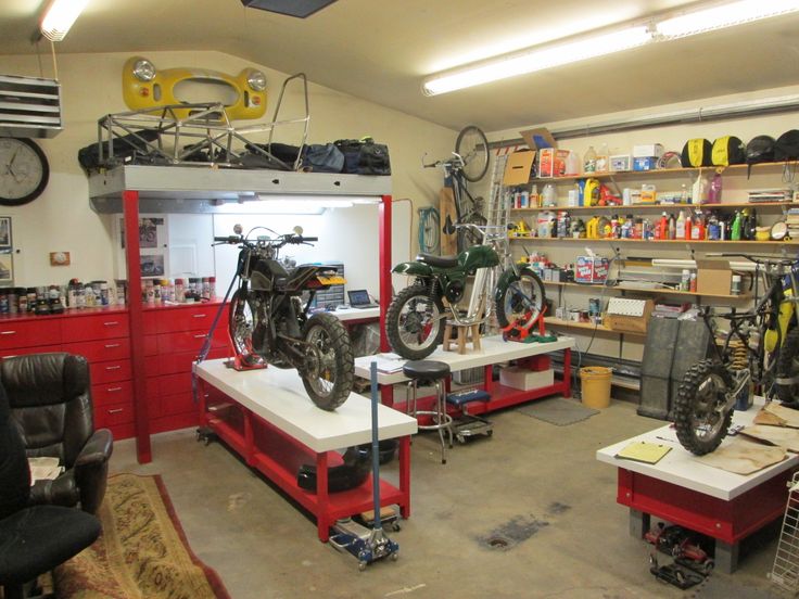 a garage filled with lots of bikes and tools