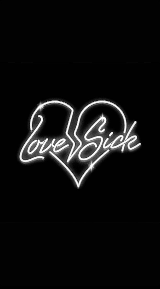 the words love sick written in white neon letters on a black background with a heart