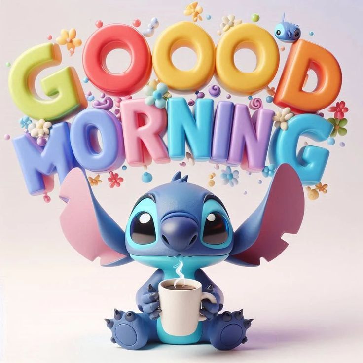 a small toy elephant holding a cup with the words good morning on it's head