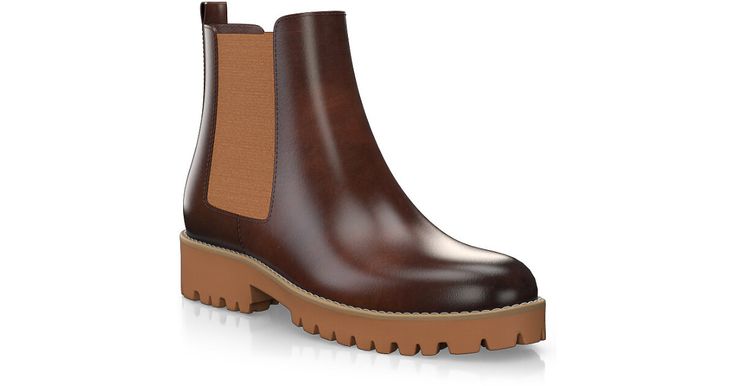 a pair of brown boots with wooden soles on the bottom and heeled outs