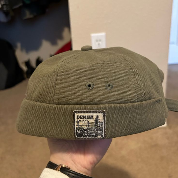 Never Worn Green Brimless Hat. Trendy Khaki Cotton Hat, Trendy Khaki Hat With Curved Brim, Khaki Flat Cap For Winter, Khaki Winter Flat Cap, Casual Flat Cap For Summer, Casual Summer Flat Cap, Adjustable Short Brim Beanie For Outdoor, Trendy Khaki Cap, Green Flat Cap For Summer