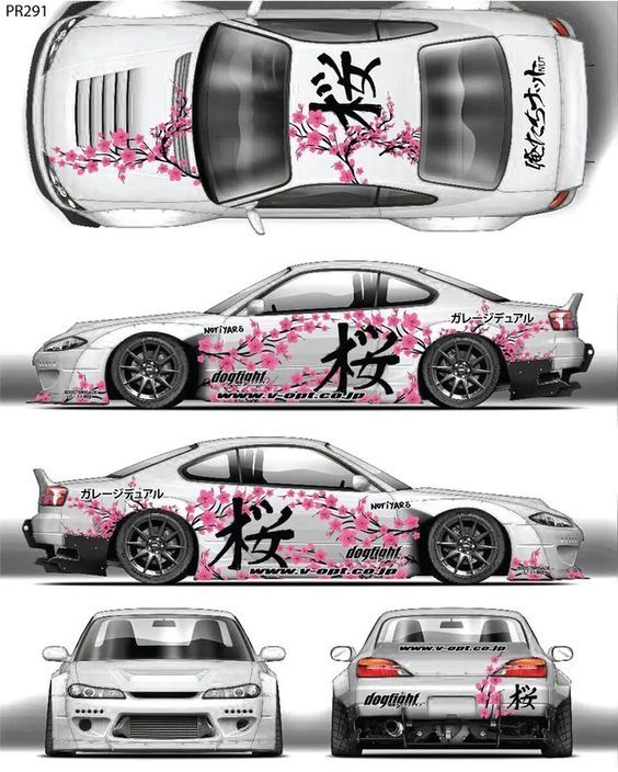 a car with pink flowers painted on it's side, and the rear end is shown