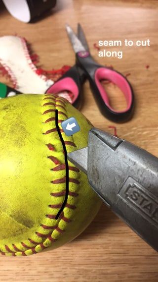 a pair of scissors and a ball on a table