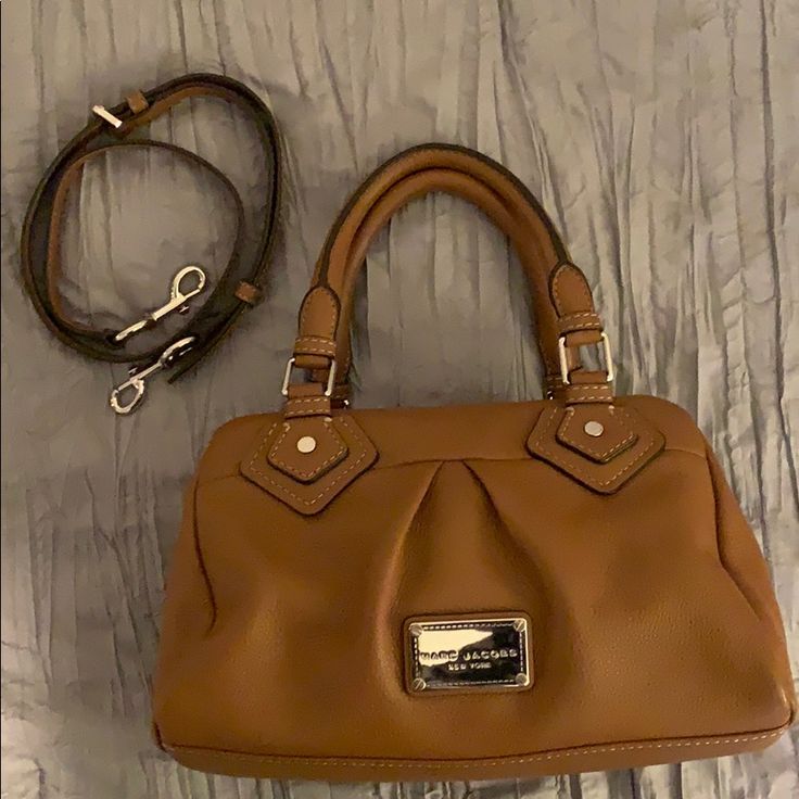 Beautiful Almost Pristine Marc Jacobs Leather Handbag. Cognac Brown In Color. With Silver Hardware. Top Handles Are In Perfect Condition Along With The Detachable, Adjustable Belted Crossbody Strap. No Marks, Tears Or Show Of Wear. Used Less Then A Handful Of Times As I Have Too Many Handbags! Love This Classic Handbag. Formal Cognac Satchel With Handles, Cognac Crossbody Bag With Detachable Handle, Brown Marc Jacobs Bag, Cognac Double Handle Shoulder Bag For On-the-go, Pre-owned Brown Bag With Double Handle, Marc Jacobs Crossbody Bag, Bags Marc Jacobs, Leather Duffel Bag, Leather Duffel