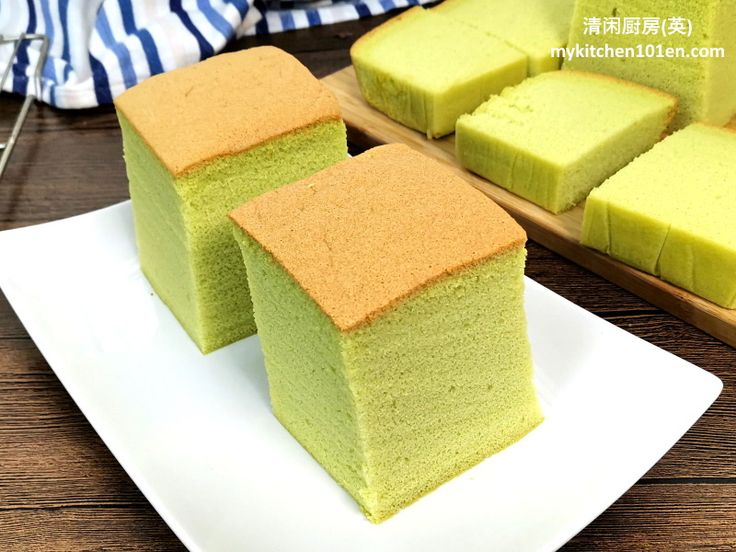 two pieces of cake sitting on top of a white plate next to another piece of cake