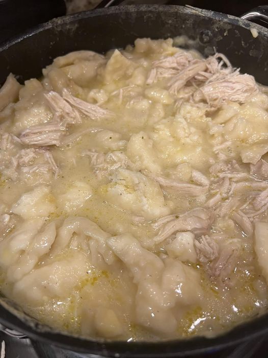 the food is being cooked in the pot on the stove top, ready to be eaten