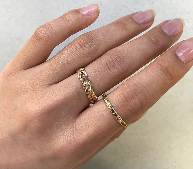 "Vintage 1940s engraved wedding band. Never been worn - what I call \"New/Old Stock\". The solid 14k yellow gold band is engraved with delicate orange blossom flowers and a milgrain edge. The band is simple and elegant on its own, but can be stacked and paired with other accessories for a lovely statement look. Other pictures show different stacking rings together and on a hand to give ideas and more details. The primary picture is the item for this listing. More information: -2.3mm -) wide (the Delicate 14k Gold Band, Delicate 14k Yellow Gold Bands, Gold Heirloom Bands Stamped 14k, Delicate Gold 14k Band, Yellow Gold Bands With Intricate Design In 14k, 14k Yellow Gold Bands With Intricate Design, Intricate Design 14k Yellow Gold Bands, Heirloom 14k Gold Milgrain Wedding Jewelry, Heirloom 14k Gold Stackable Wedding Rings