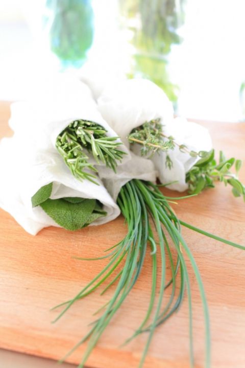 some white flowers on a wooden cutting board