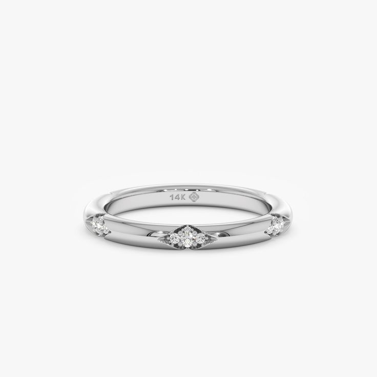 Nadia This minimalist wedding band features diamonds spaced apart, symbolizing the journey and moments shared. Handmade with genuine craftsmanship, this delicate and dainty ring is the perfect choice for bridal jewelry, offering a timeless and elegant look. Add to your solid gold ring stack to create unique interest, yet stunning to wear alone! - Handmade- Solid Gold- Natural Diamonds - G Color, SI Quality Diamonds- Total Diamond Carat Weight: 0.26 ctw- The Thickness of the Band: 2 mm All pieces Luxury Dainty Stackable Rings In Diamond White, Delicate White Stackable Diamond Ring, Minimalist 14k White Gold Diamond-cut Jewelry, Minimalist Diamond-shaped Jewelry In Diamond White, Delicate Diamond-cut Stackable Diamond Rings, Minimalist Wedding Band, Solid Gold Ring, Ring Stack, Gold Ring Stack