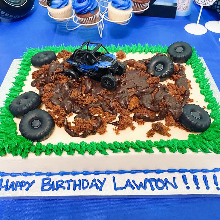 a monster truck birthday cake with chocolate frosting