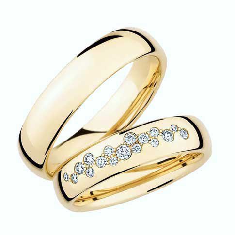 two gold wedding rings with diamonds on them