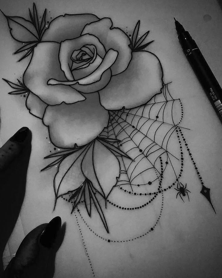 a drawing of a rose and spider web