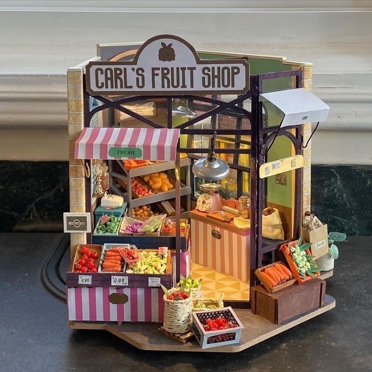 a miniature fruit shop with lots of fresh fruits and vegetables