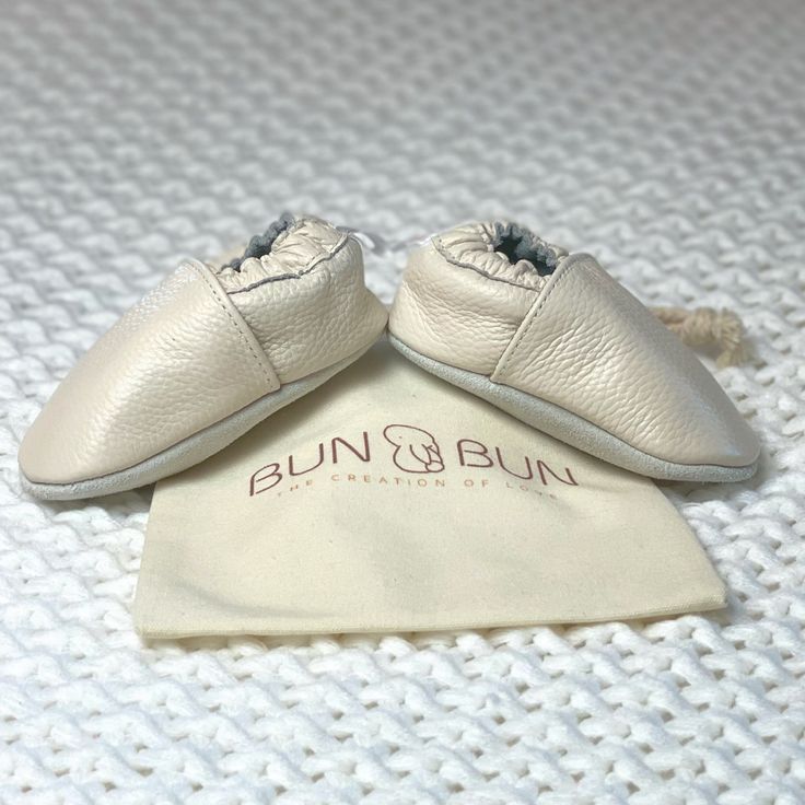 Bun🐰Bun leather moccasin baby shoes, are so easy to slip on and off. ❤️🐰Shop Now @bunbuncorp #babyshoes #babyfirststeps #babygifts #bunbuncorp Classic Cream Slip-on Moccasins, Comfortable Beige Leather Shoes, Comfortable White Leather Shoes With Round Toe, Comfortable White Leather Shoes, White Round Toe Comfortable Leather Shoes, Cream Leather Slip-ons, Soft Cream Round Toe Slippers, Comfortable Beige Leather Shoes With Rubber Sole, Beige Moccasins With Rubber Sole