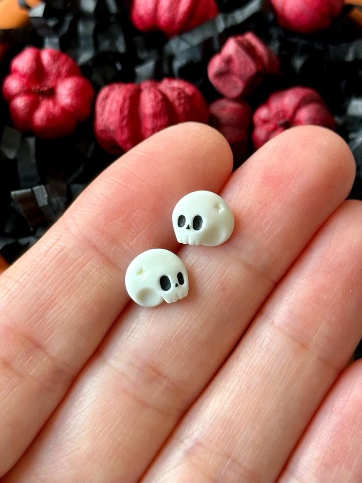 These adorable skull stud earrings are the perfect blend of spooky and cute! These tiny skulls add a touch of quirky charm to any outfit. Whether you're embracing the Halloween spirit or simply love unique accessories, these earrings are a must-have. Lightweight and comfortable for everyday wear, they make a great gift for anyone who appreciates a bit of whimsy in their style. *Product size is approx. 0.9cm in height and 0.7cm in width. Earrings are completely handmade out of polymer clay. Each Halloween Clay Charms, Halloween Clay Earrings, Clay Earrings Halloween, Halloween Clay, Stud Earrings Unique, Quirky Earrings, Unique Accessories, Tiny Earrings, Clay Dolls