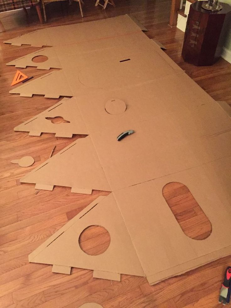 cardboard christmas tree cut out on the floor