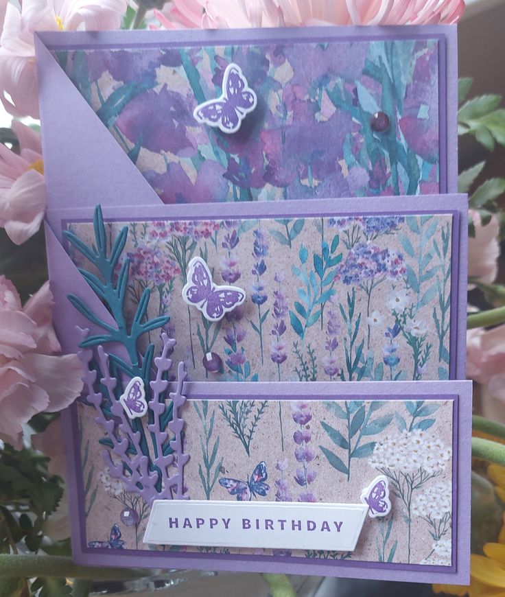 a close up of a greeting card with flowers and butterflies on it, along with the words happy birthday