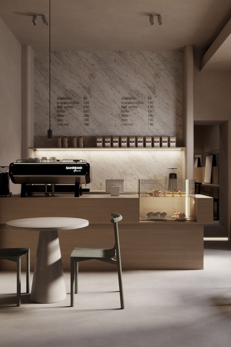 an empty restaurant with tables and chairs in front of the counter, along with menus on the wall