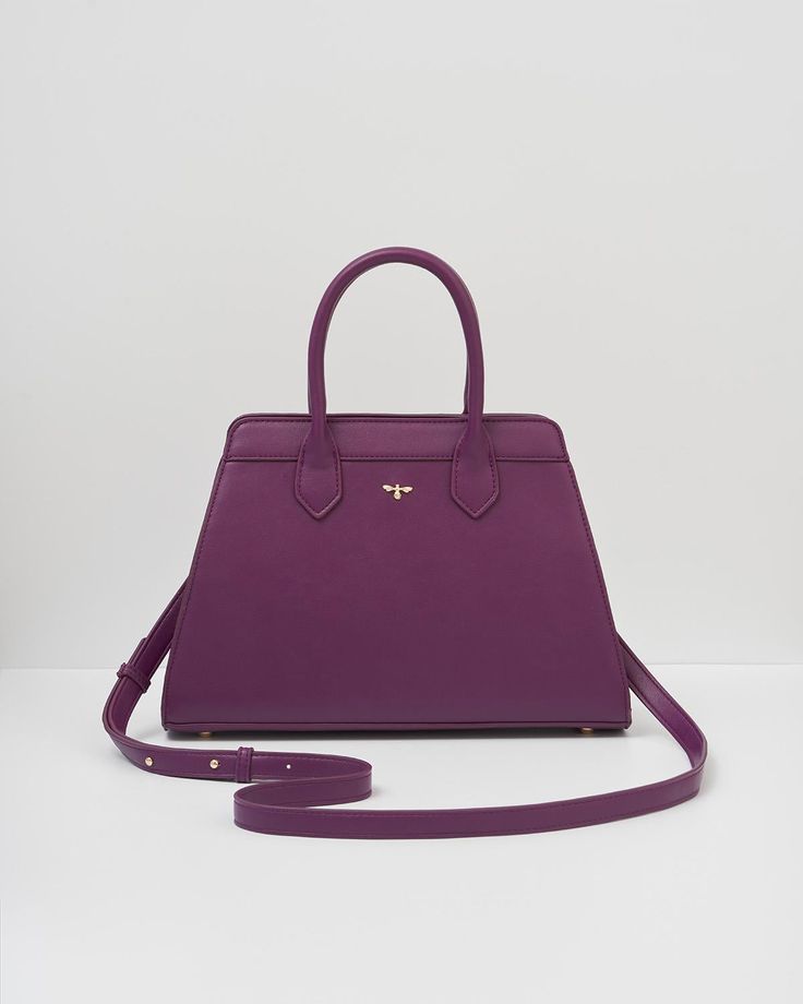 Our classic tote has been beautifully updated with our Floral Engravings Print. Crafted from recycled faux leather in plum and featuring a twilly scarf wrapped around the handle. With ample space and luxe gold-tone hardware, it’s perfect for carrying books and souvenirs from your favorite exhibitions.

Key features:


Outer: 100% Polyurethane; Lining: 100% Polyester Scarf: 100% Polyester



Approx. 34 (L) x 21 (H) x 12 (D) cm



Wipe clean with a damp cloth Luxury Purple Satchel With Handles, Elegant Purple Satchel Shoulder Bag, Chic Purple Office Bag, Classic Purple Bag With Detachable Handle, Purple Tote Bag For Office, Luxury Purple Satchel With Top Carry Handle, Chic Purple Satchel With Detachable Handle, Purple Office Tote Bag, Burgundy Satchel With Double Handle