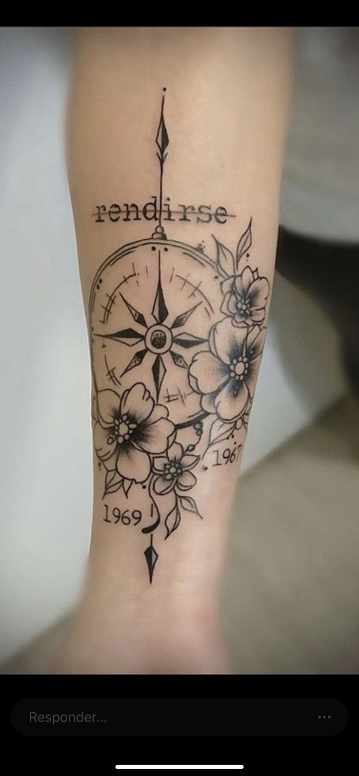 a woman's leg with a compass and flowers on it