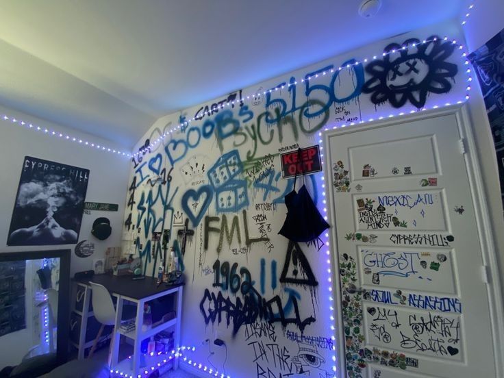 a room that has some writing on the wall and lights all around it in different colors