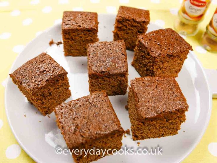 several pieces of brownie on a white plate