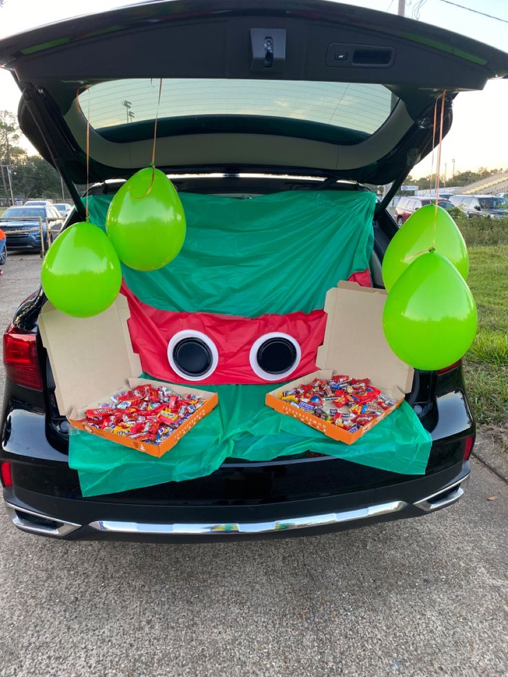 the trunk of a car is decorated with decorations